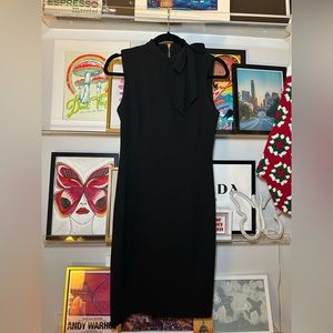 Chic black dress with bow and gold zipper